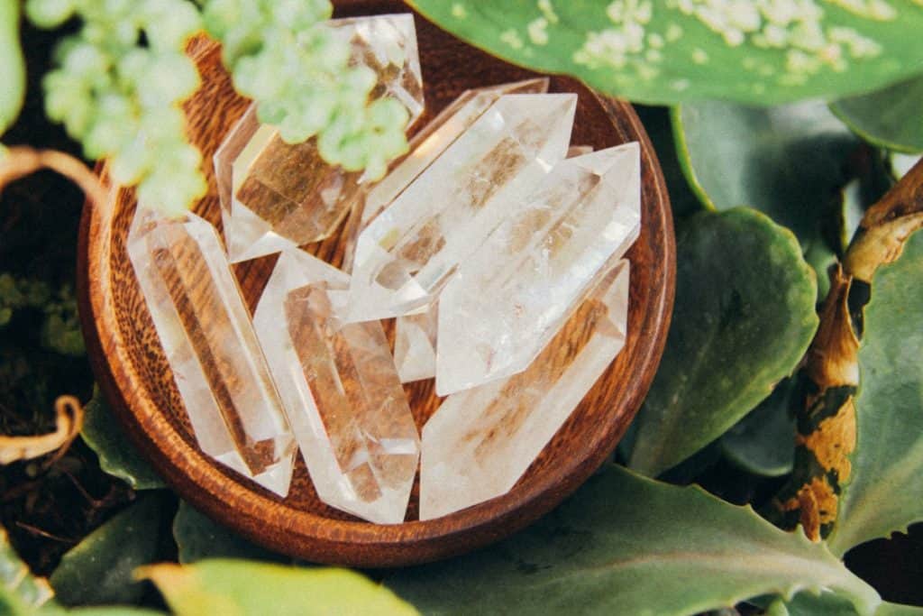 clear quartz crystal points in a bowl